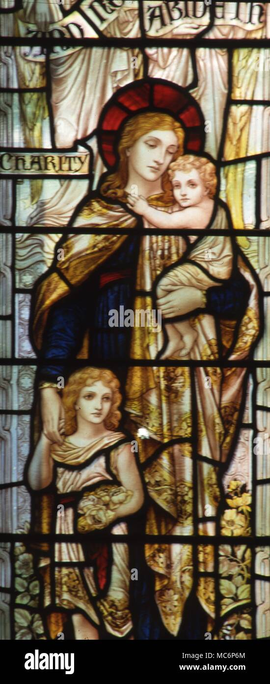 Symbol der Liebe. Frau mit zwei Kindern in einem Glasfenster in der Kirche von St Mary, Godstone. Surrey dargestellt Stockfoto