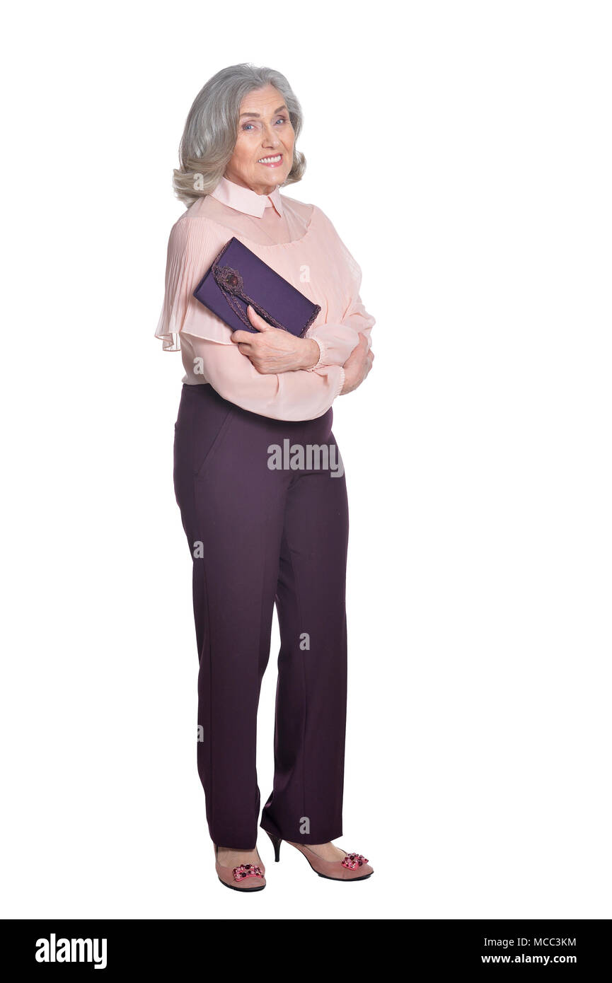 Gerne ältere Frau mit Handtasche Stockfoto