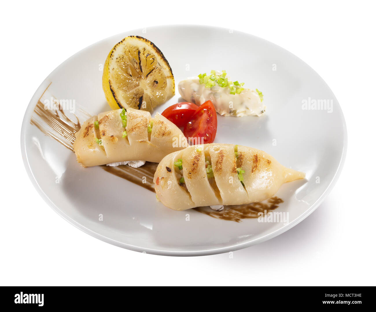 Gefüllte Tintenfische auf einem Teller. Stockfoto