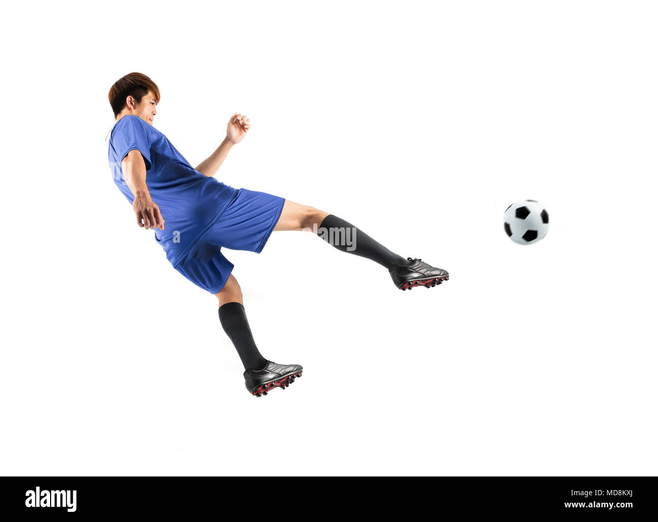 Asiatische Fußball-Spieler in Aktion isoliert weißer Hintergrund Stockfoto