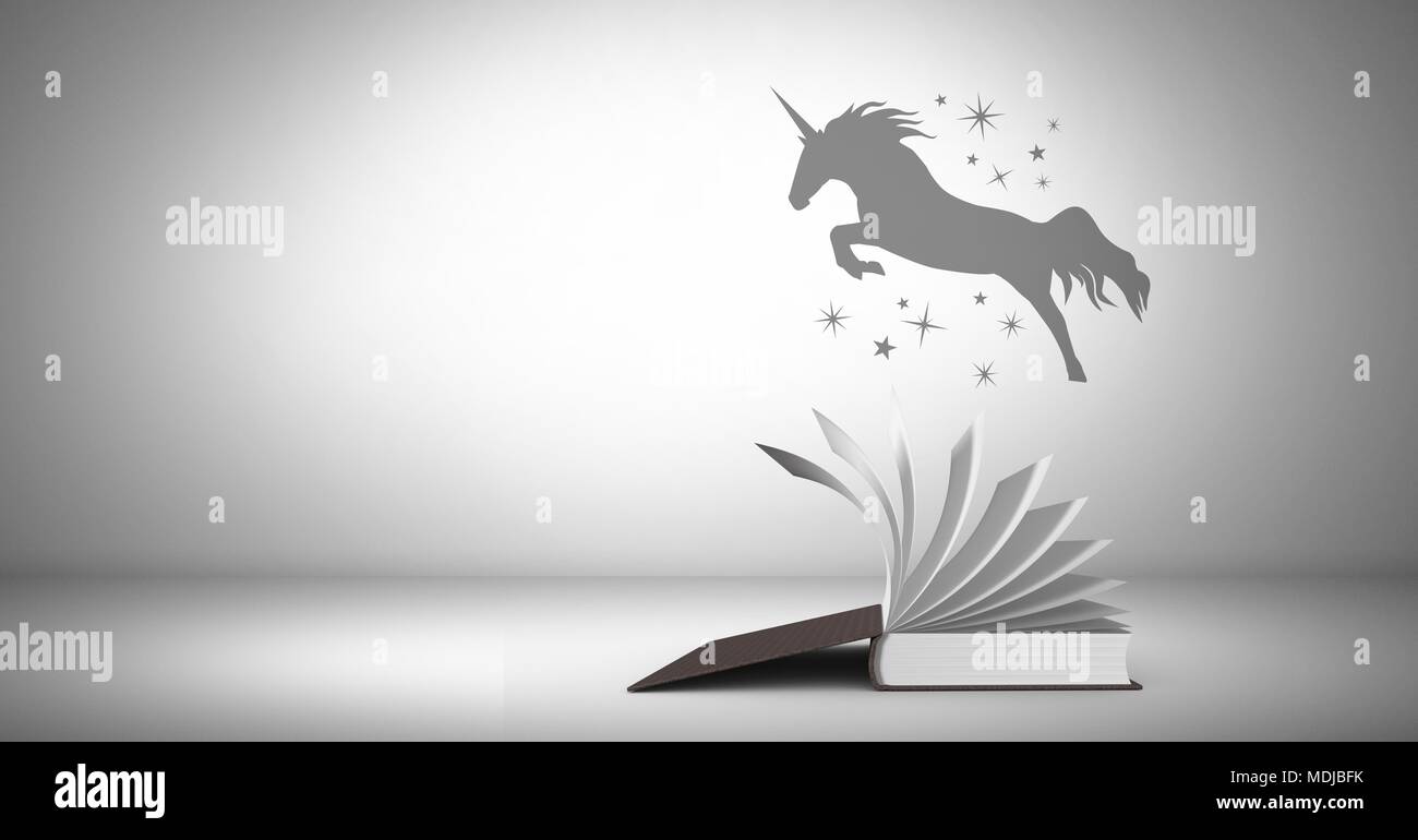 Einhorn Silhouette über magische Buch fliegen Stockfoto