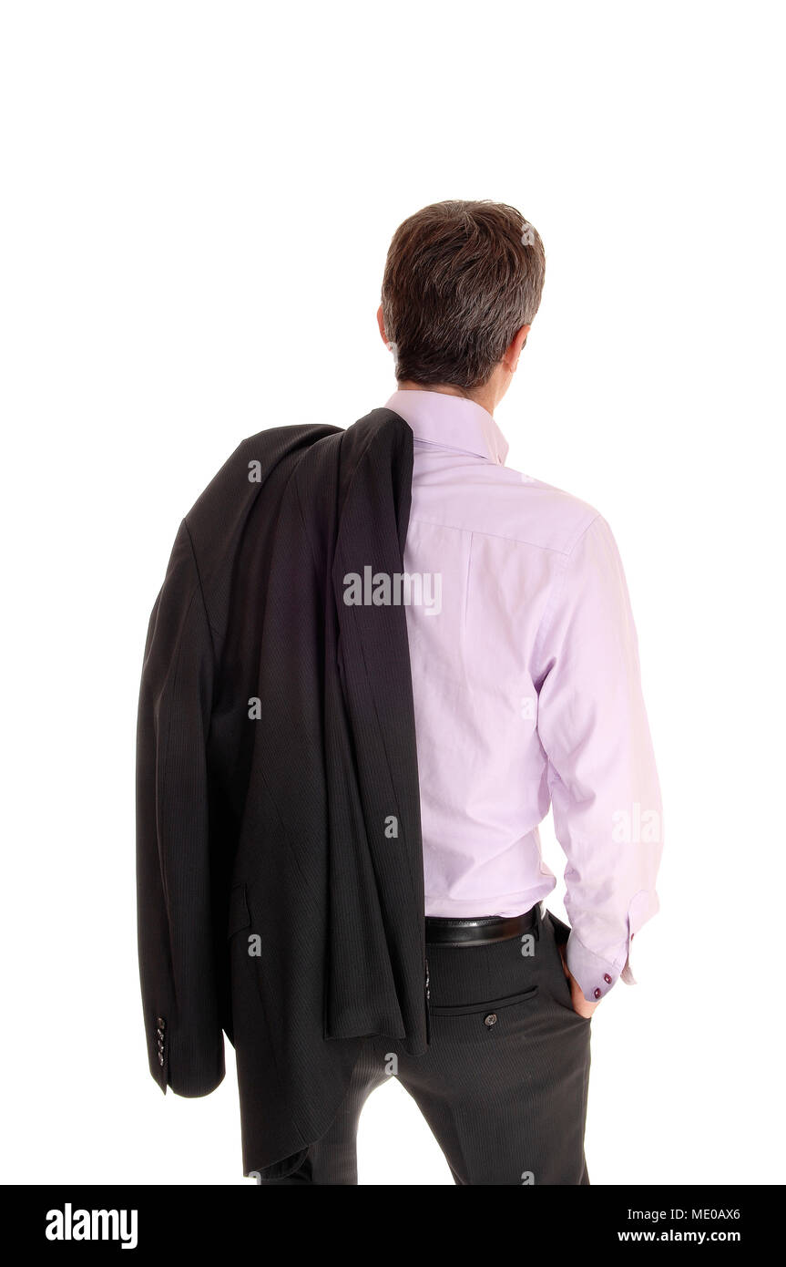 Ein hübscher junger Geschäftsmann stehend von der Rückseite mit seine Jacke über die Schulter, auf weißem Hintergrund Stockfoto