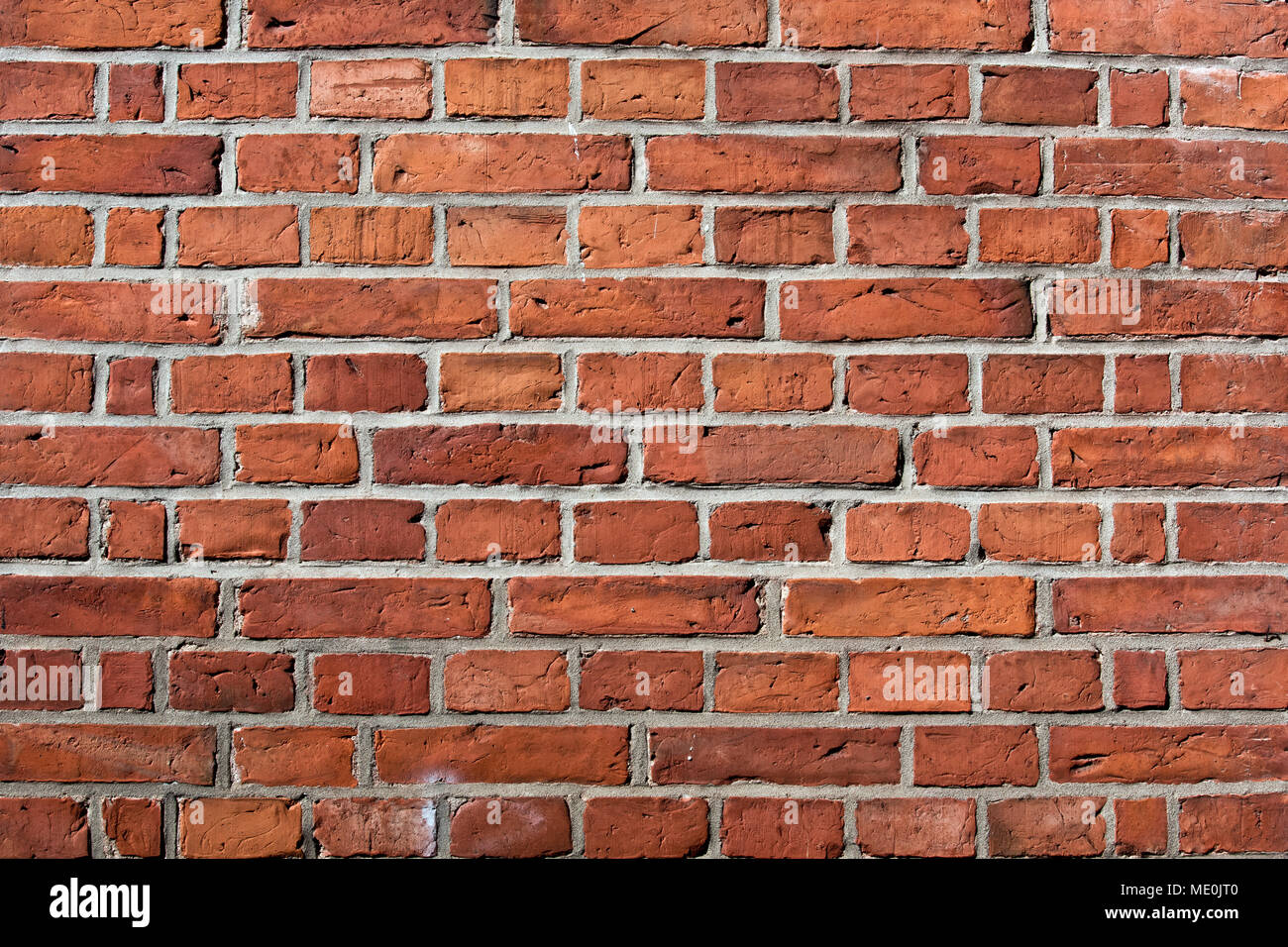 Red brick wall, Bausteine in einer Linie Hintergrund Stockfoto