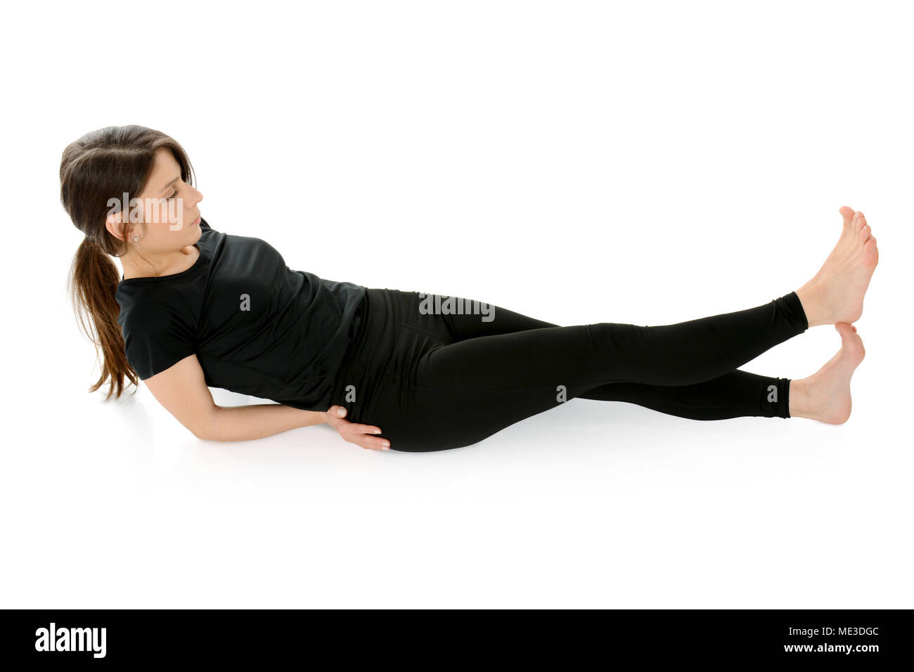 Junge Frau beim yoga Stockfoto
