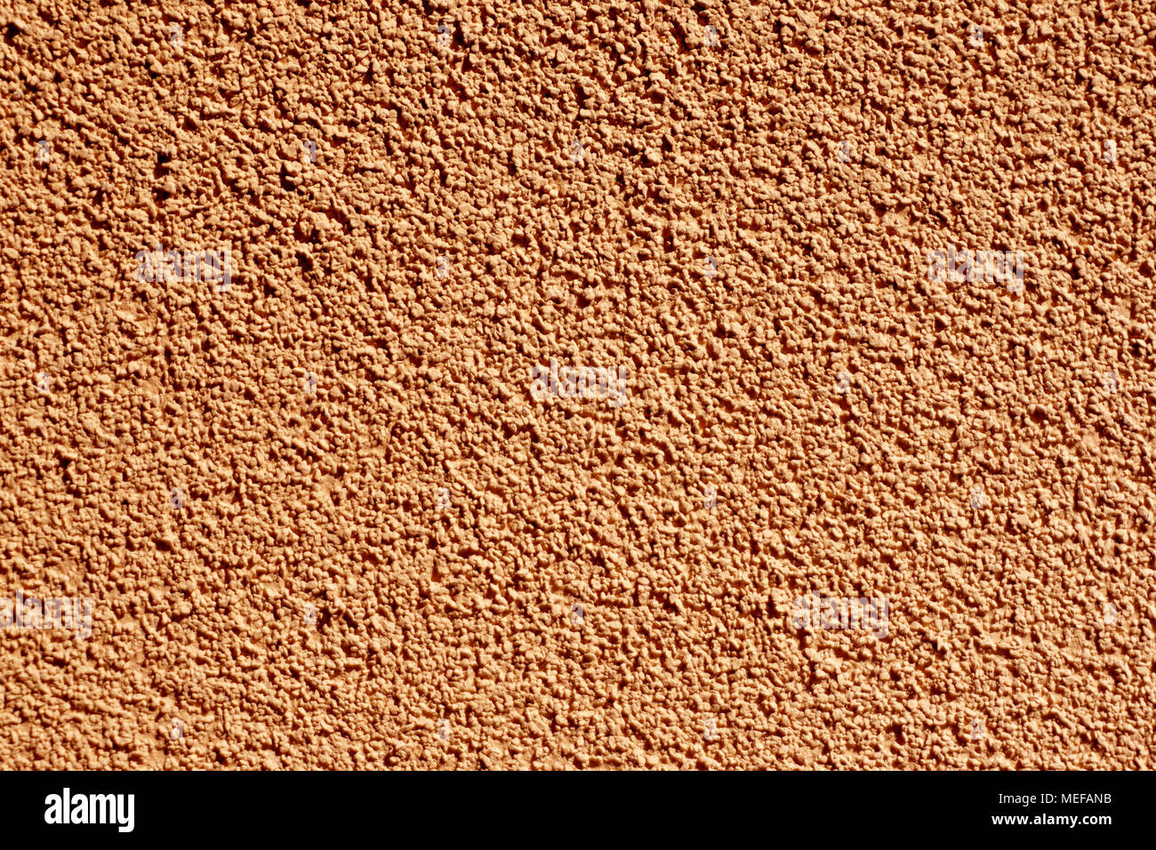 Fassade aus Stein Gips Hintergrund Farbe in Terrakotta Stockfotografie -  Alamy