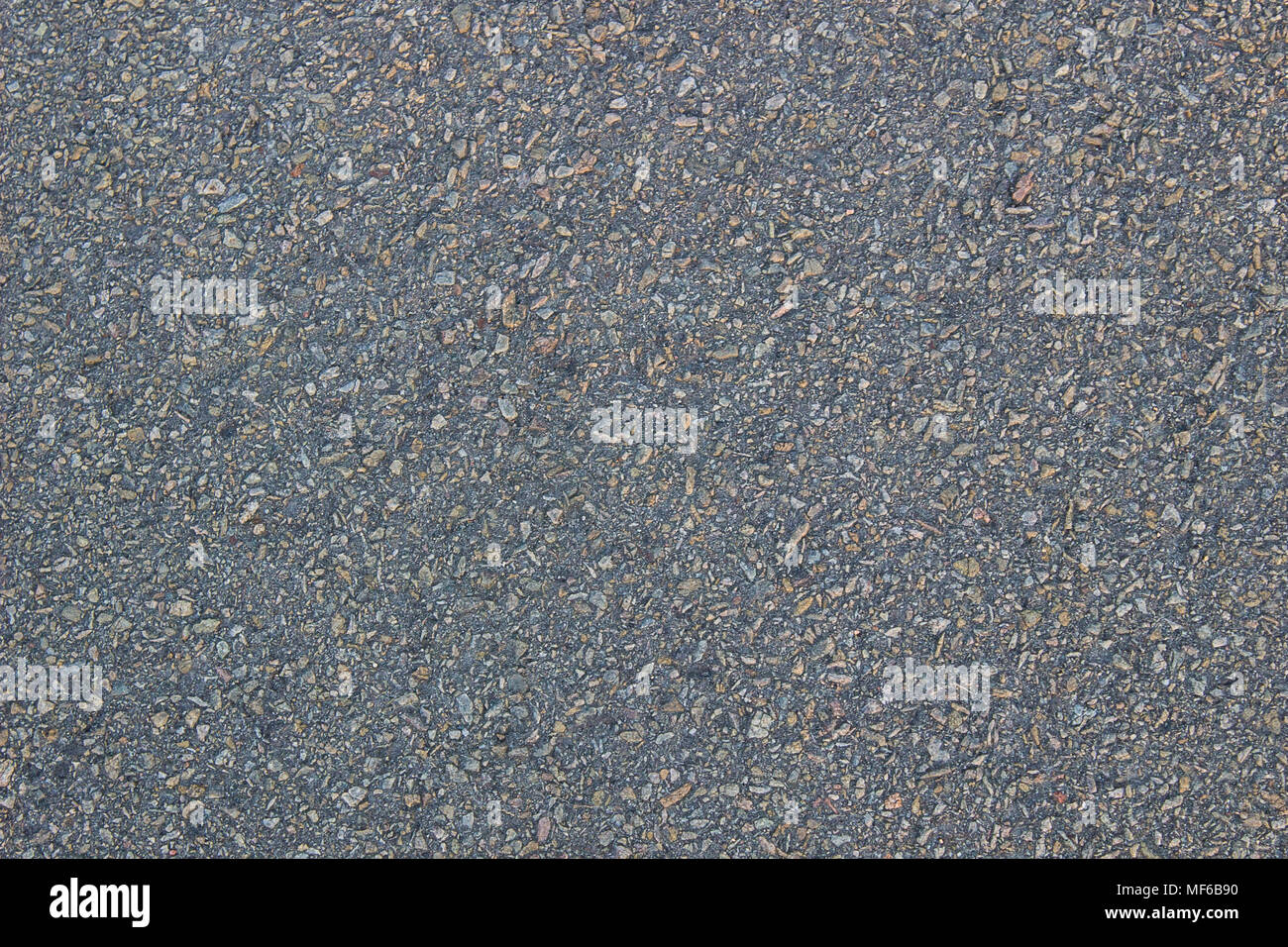 Asphalt Textur mit Patches von Stein, Hintergrund Stockfoto