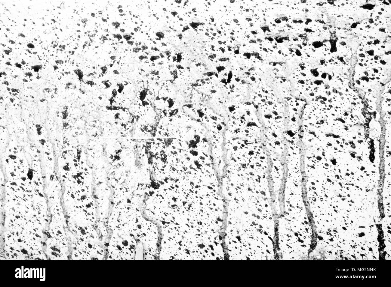Tintenfleck an der Wand im Hintergrund. Stockfoto
