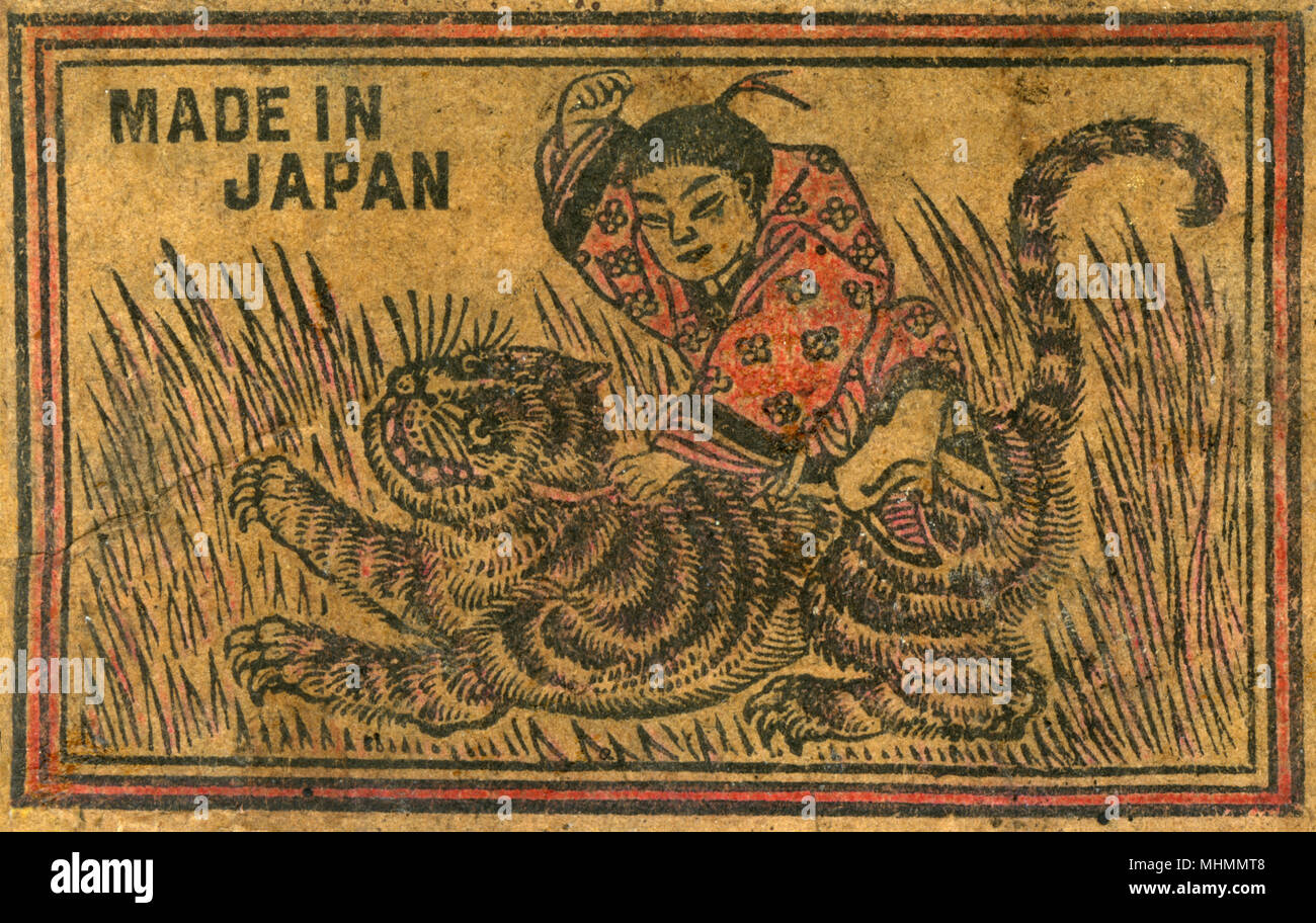 Altes japanisches Matchbox-Label mit einem Mann, der gegen einen Tiger kämpft Stockfoto