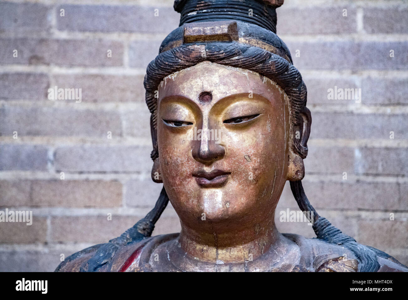 Alte 1200 dc Guanyin Statue buuddhism Gesicht detail Stockfoto