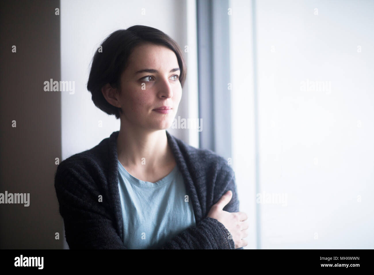 Junge Frau Tagträumen Stockfoto