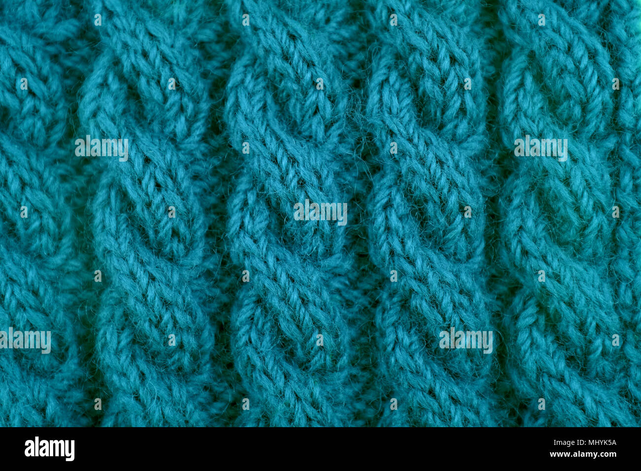 Detail der Teal handknit Spiralkabel Seil Kabel stricken Nähen als abstrakt Hintergrund Stockfoto