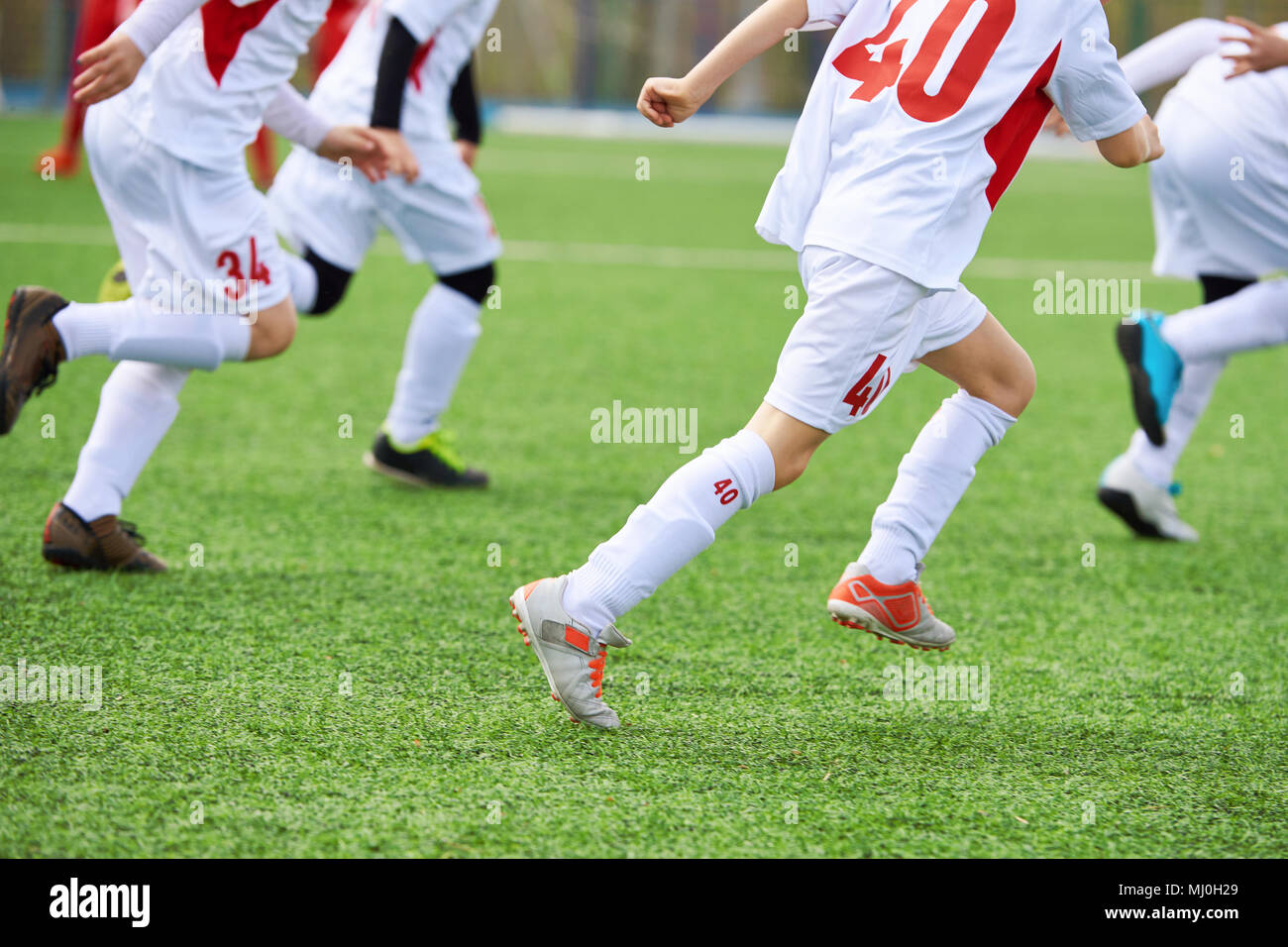 Kinder Fußball Spieler Training auf dem Fußballplatz Stockfoto