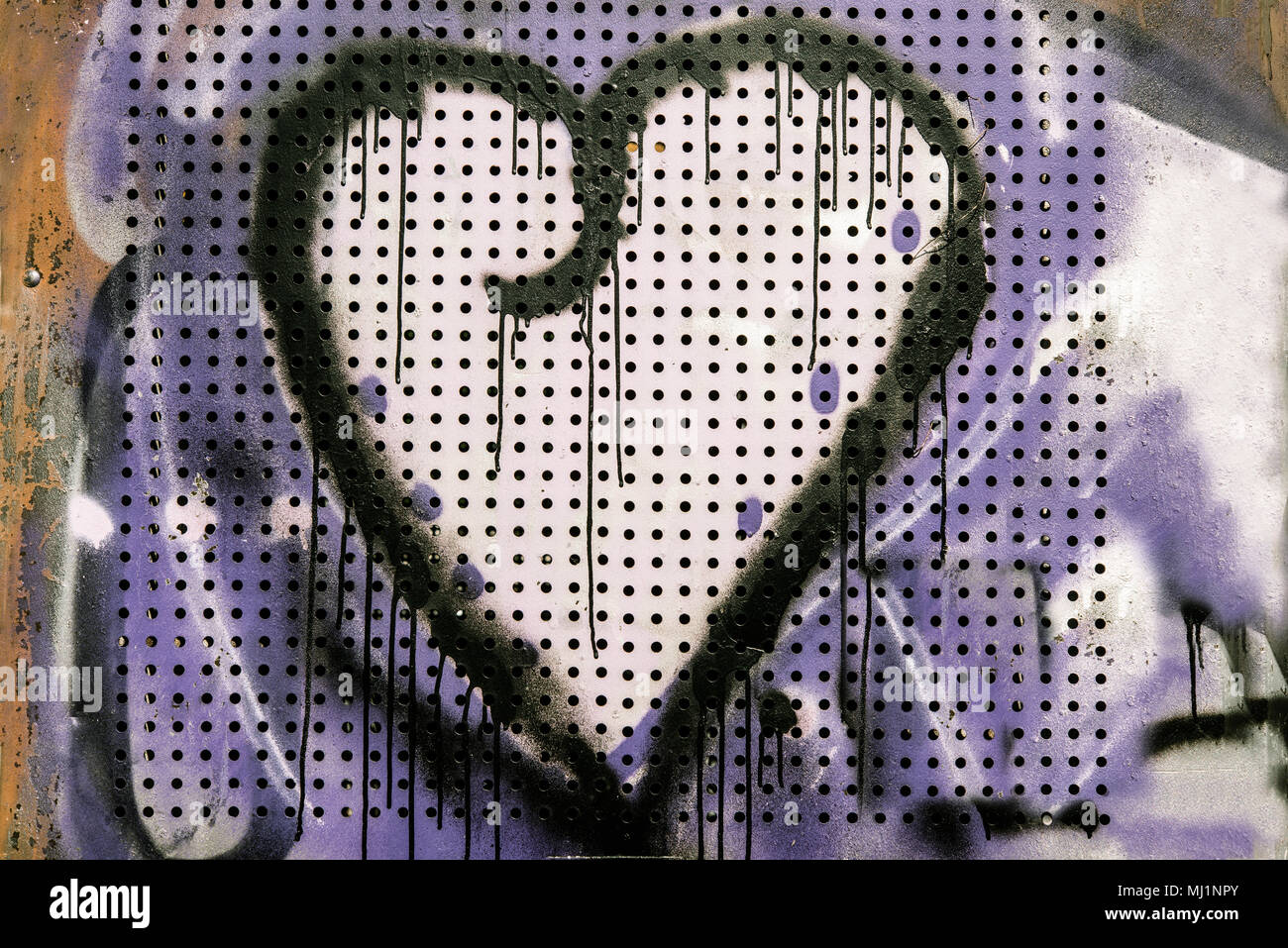 Graffiti Herz an einer Wand Stockfoto