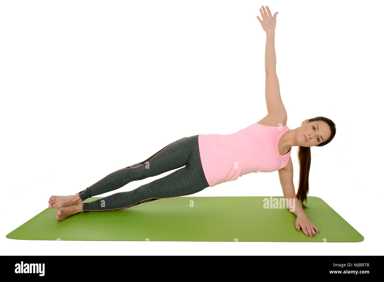 Junge Frau Yoga Asana Vasisthasana, seitlicher Ganzkörperstütz Stockfoto