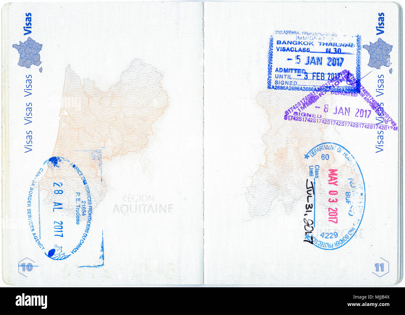 Briefmarken von Kanada, den Vereinigten Staaten und Thailand in einen französischen Pass. Persönliche Daten entfernt Stockfoto