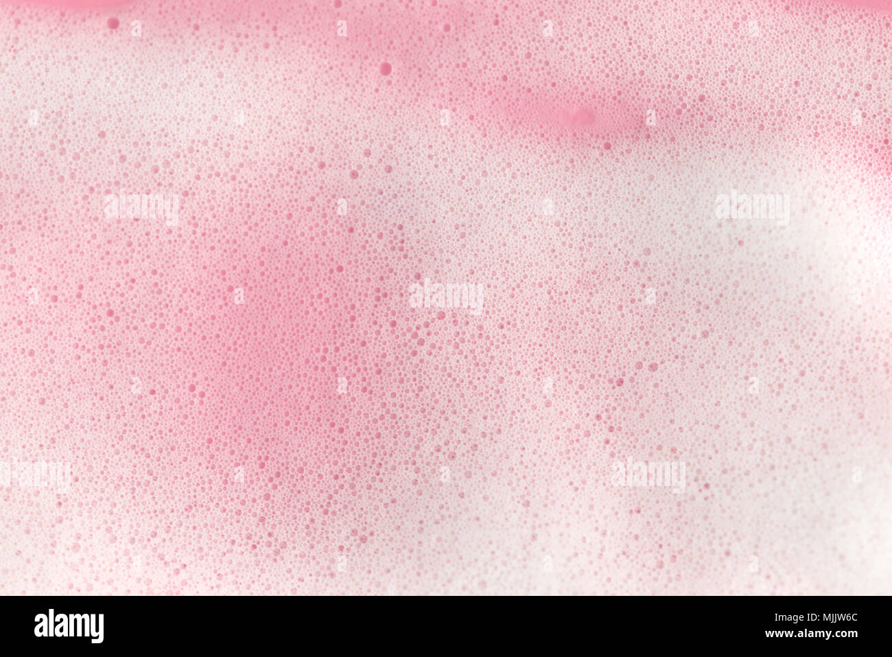 Seife Schaum Blasen auf rosa Hintergrund Makro Nahaufnahme. Stockfoto
