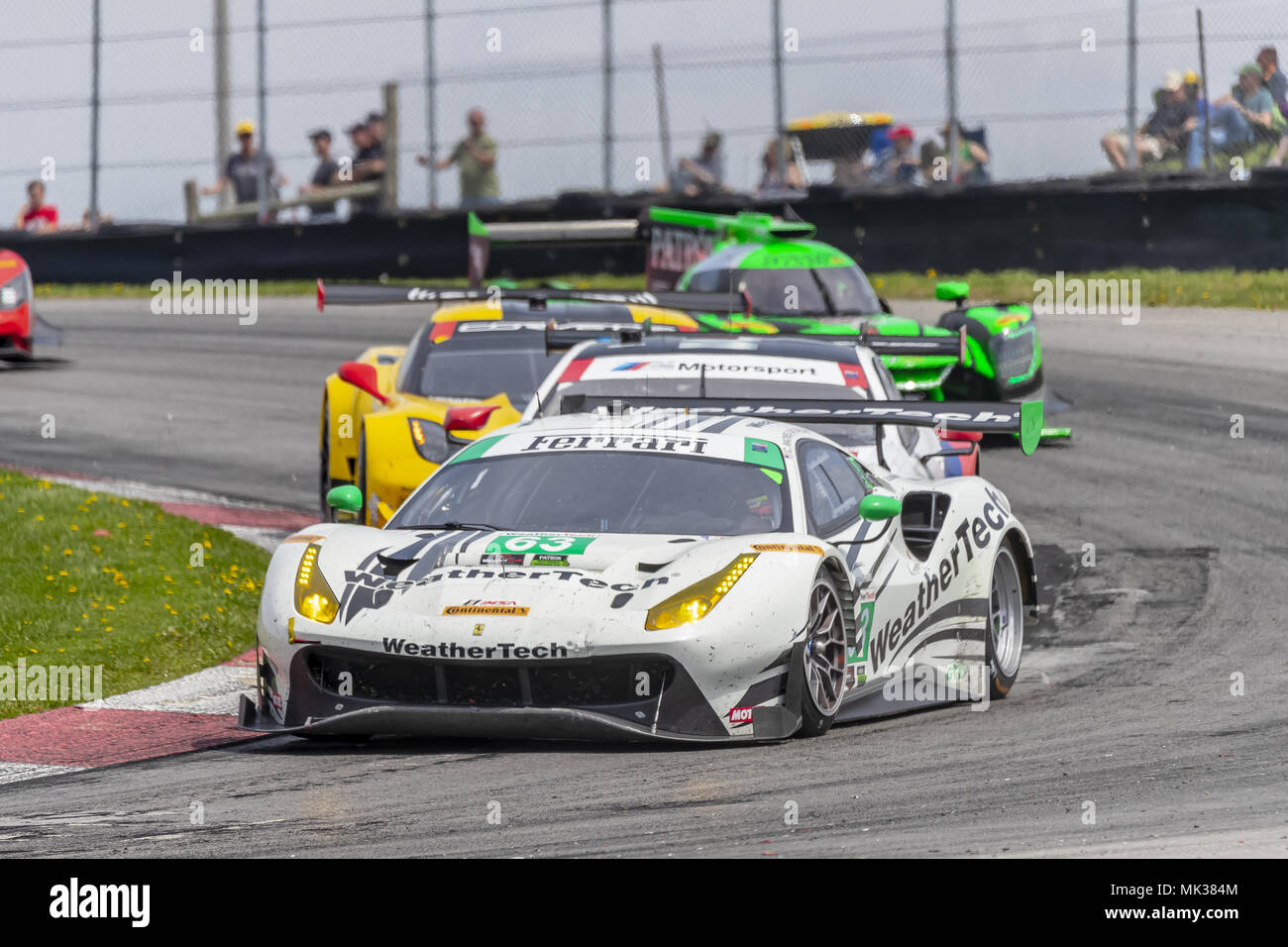 Lexington, Ohio, USA. 6. Mai, 2018. Die Scuderia Corsa Ferrari 488 GT3 Car Rennen durchs Schlüsselloch drehen, während der die Acura Sports Car Challenge in Mid Ohio-Kurs in Lexington, Ohio. Quelle: Walter G Arce Sr Asp Inc/ASP/ZUMA Draht/Alamy leben Nachrichten Stockfoto