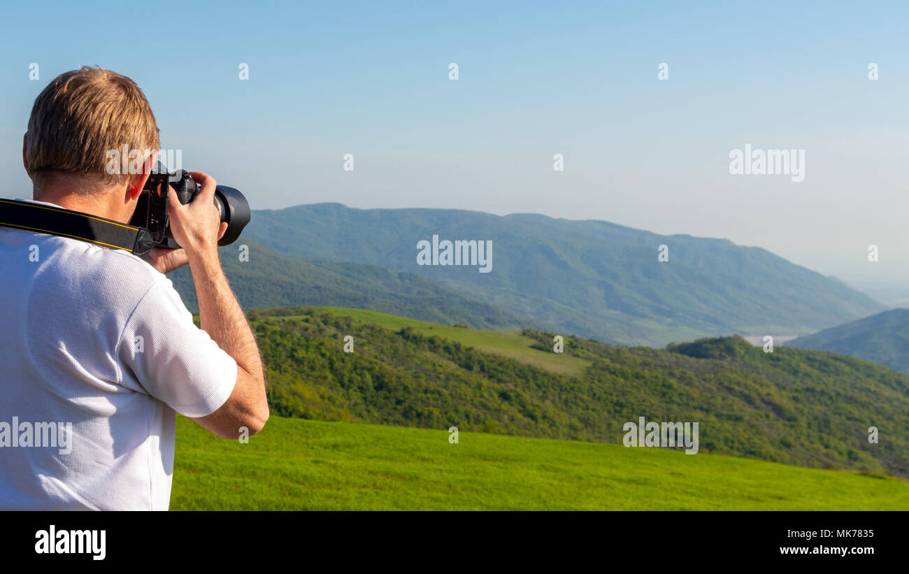 Natur Fotograf in den Bergen Stockfoto