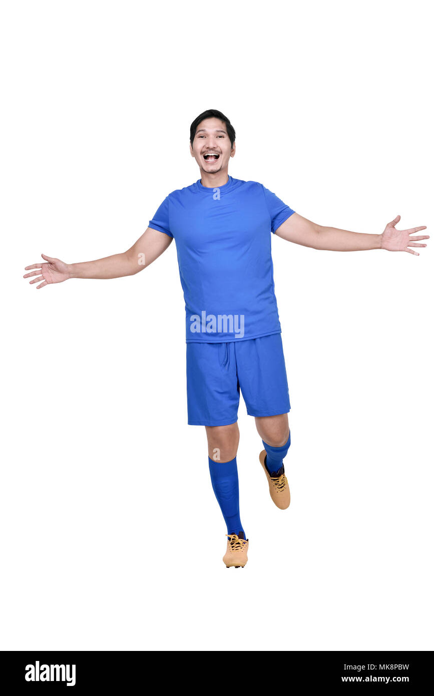 Portrait von asiatischen footballer Mann mit glücklichen Ausdruck über weißem Hintergrund posiert Stockfoto