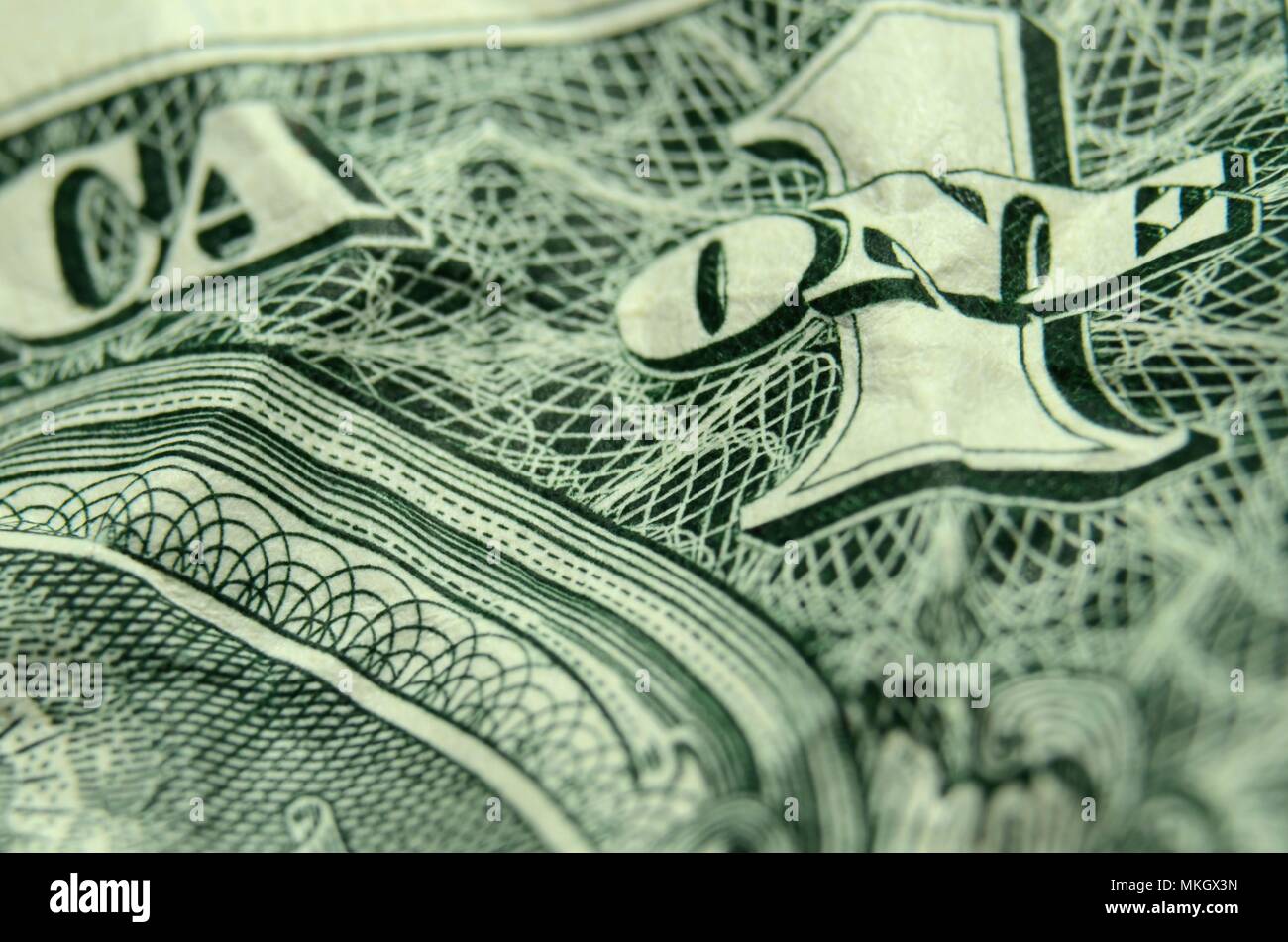 Flache Tiefenschärfe Nahaufnahme der Eine auf einem Zerknitterten amerikanischer Dollar Bill. Stockfoto