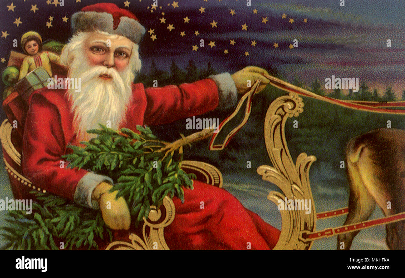 Santa mit Baum im Schlitten Stockfoto