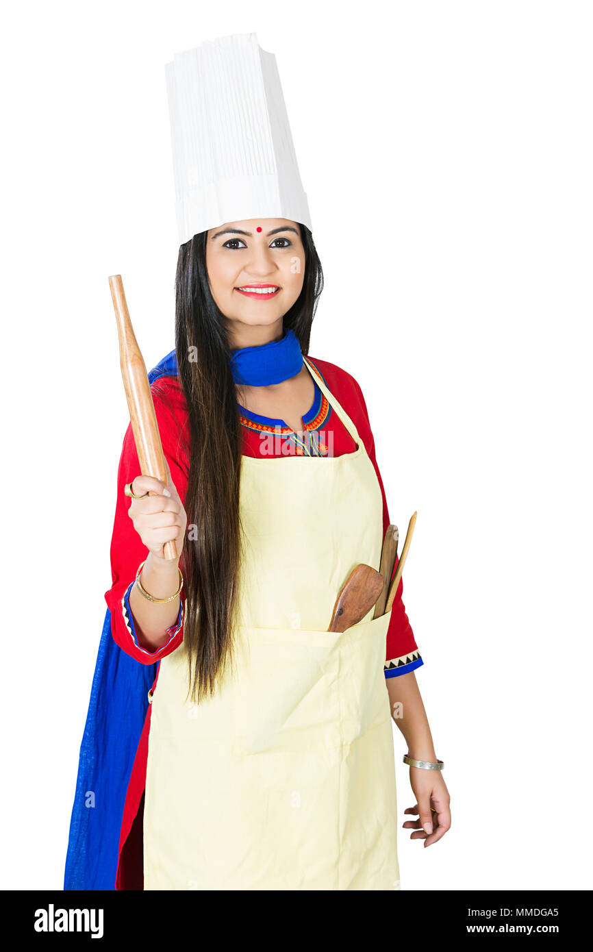 Ein weiblicher Hausfrau kocht zu tragen hat, mit Schürze Holding Rolling-Pin Stockfoto