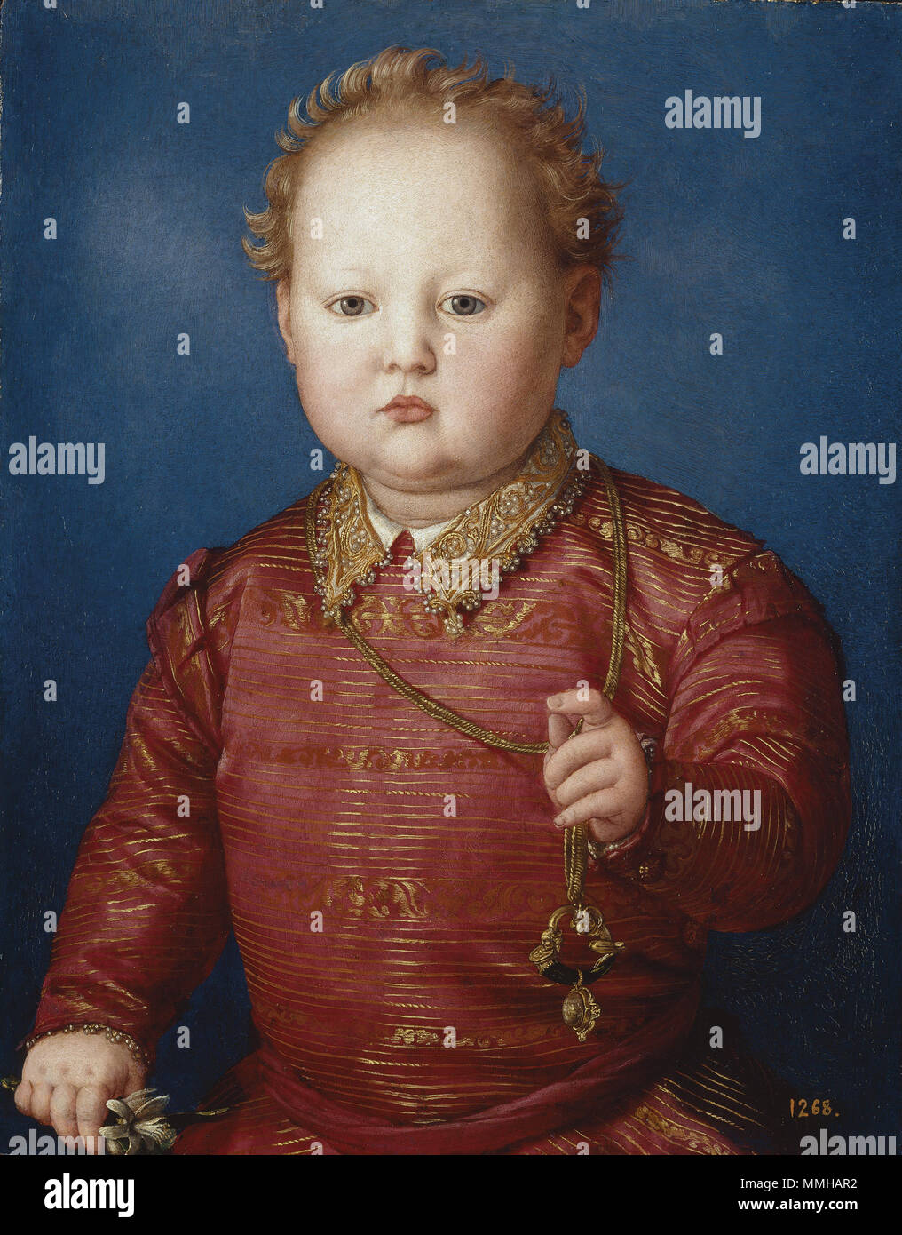 . Eine halbe Länge Abbildung von García von Medici (1547-1562), dritter Sohn des Großherzogs der Toskana, Cosme I der Medici (1519-1474), und seiner Frau, Leonor von Toledo (Ca. 1522 - 1562). Der Junge ist im Alter von drei oder vier auf einem neutralen Hintergrund abgebildet. In seiner rechten Hand hält er eine orange Blüte und in der Linken, ein kleines Juwel, das wie ein Amulett. Italienisch: Garzia de' Medici Garcia de' Medici. ca. 1550. Garcia de' Medici von Angelo Bronzino Stockfoto