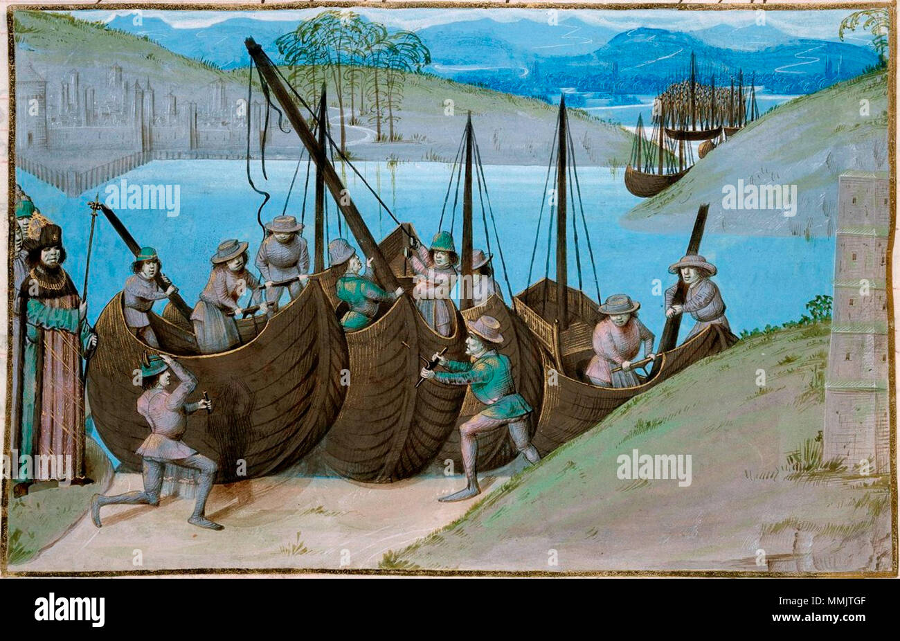 . Englisch: Detail einer Miniatur der Gebäude von Cäsars Flotte von Schiffen. Abbildung des späten 15. Jahrhunderts mit einem Thema der Alte Geschichte (Caesar's Expedition in England), aber zeigt mittelalterliche Schiffe. Herkunft: Niederlande, (Brügge) Français: Illustration de la fin du xve siècle reprenant une thème de l'histoire Antike (Expédition de César en Angleterre) Mais montrant des nefs médiévales. Origine: Brügge. Nach 1471, vor 1483. Attribution: Master der London Wavrin Bau de navires au XVe siecle Ein terre Stockfoto