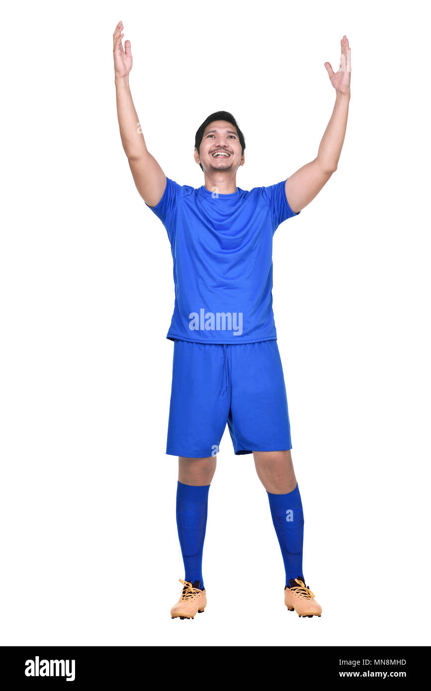 Happy Asian Football Player posing Feiern auf weißem Hintergrund Stockfoto