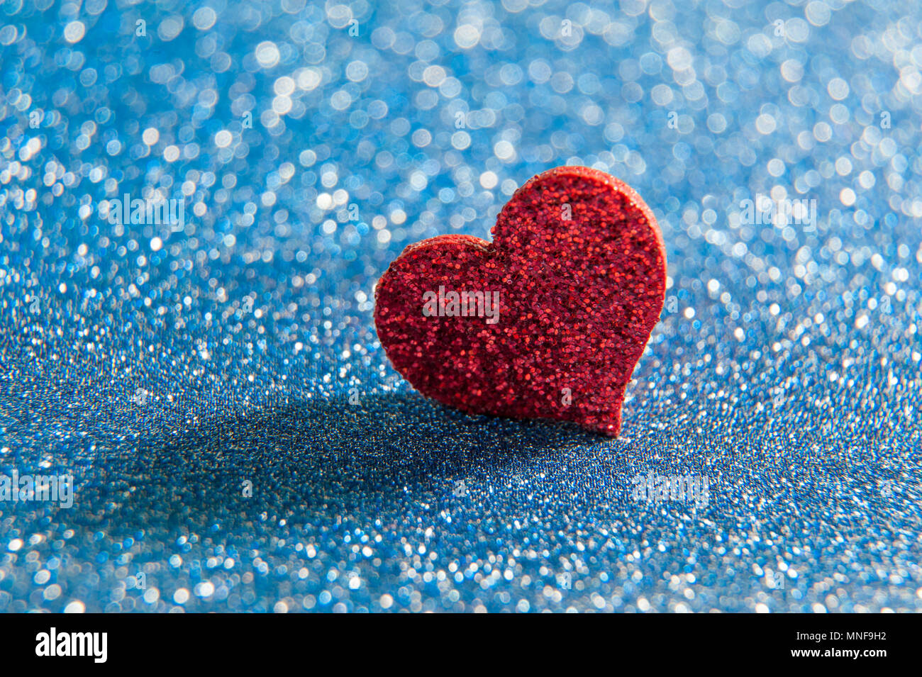 Gif Glitzer Bilder Die Sich Bewegen Herzen Blauer glitzer hintergrund -Fotos und -Bildmaterial in hoher Auflösung