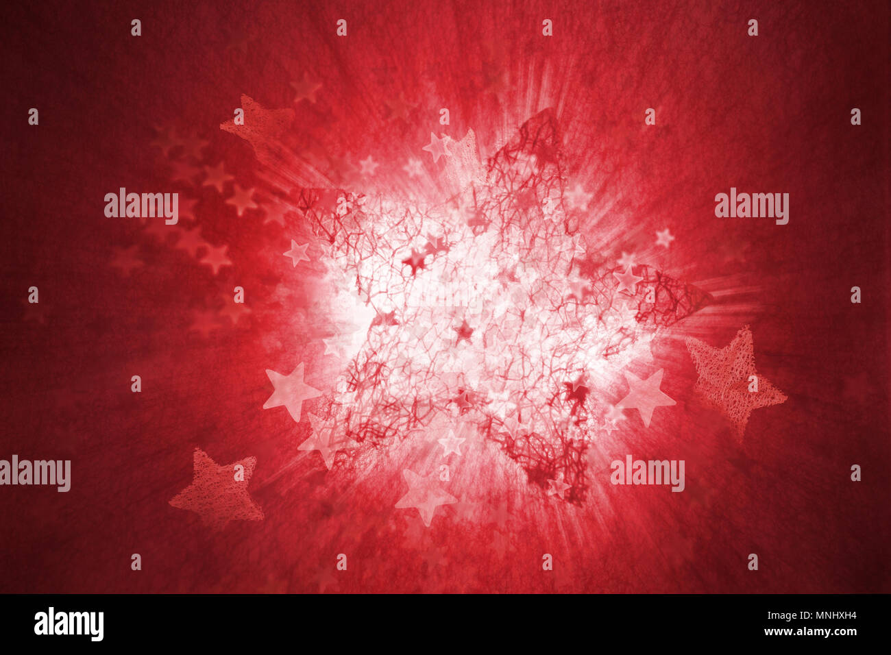 Eine strukturierte, Red Star, explodierende mit diversen anderen Stars, und eine Bewegung verschwommen, weißes Licht im Hintergrund Stockfoto
