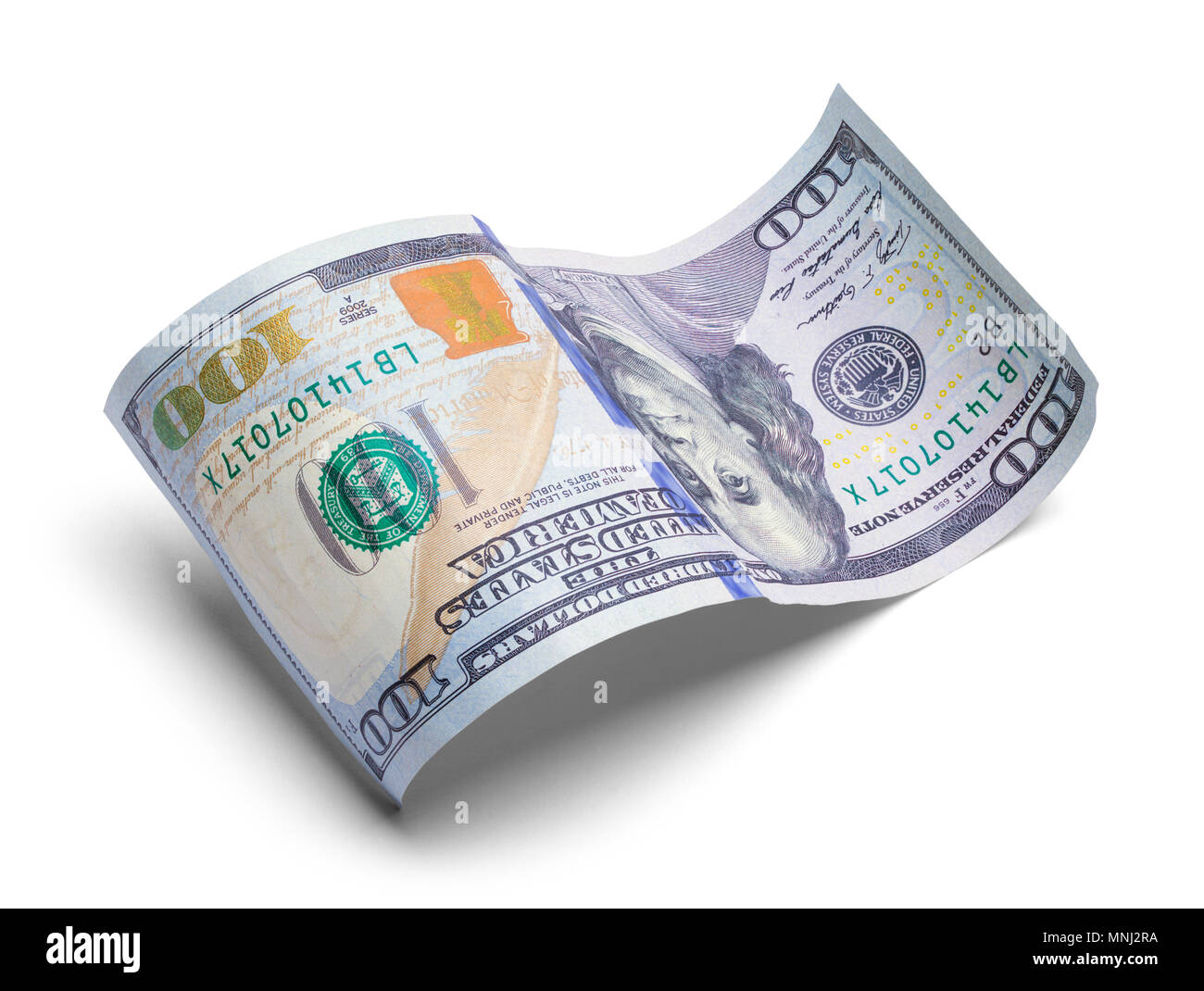 Zusammengerollt hundert Dollar Bill isoliert auf einem weißen Hintergrund. Stockfoto