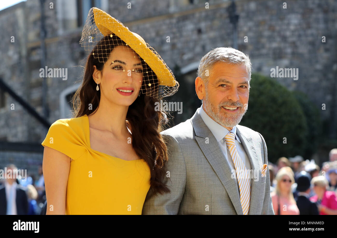 Amal Clooney George Clooney und kommen an der St. George's Chapel auf Schloss Windsor für die Hochzeit von Meghan Markle und Prinz Harry. Stockfoto