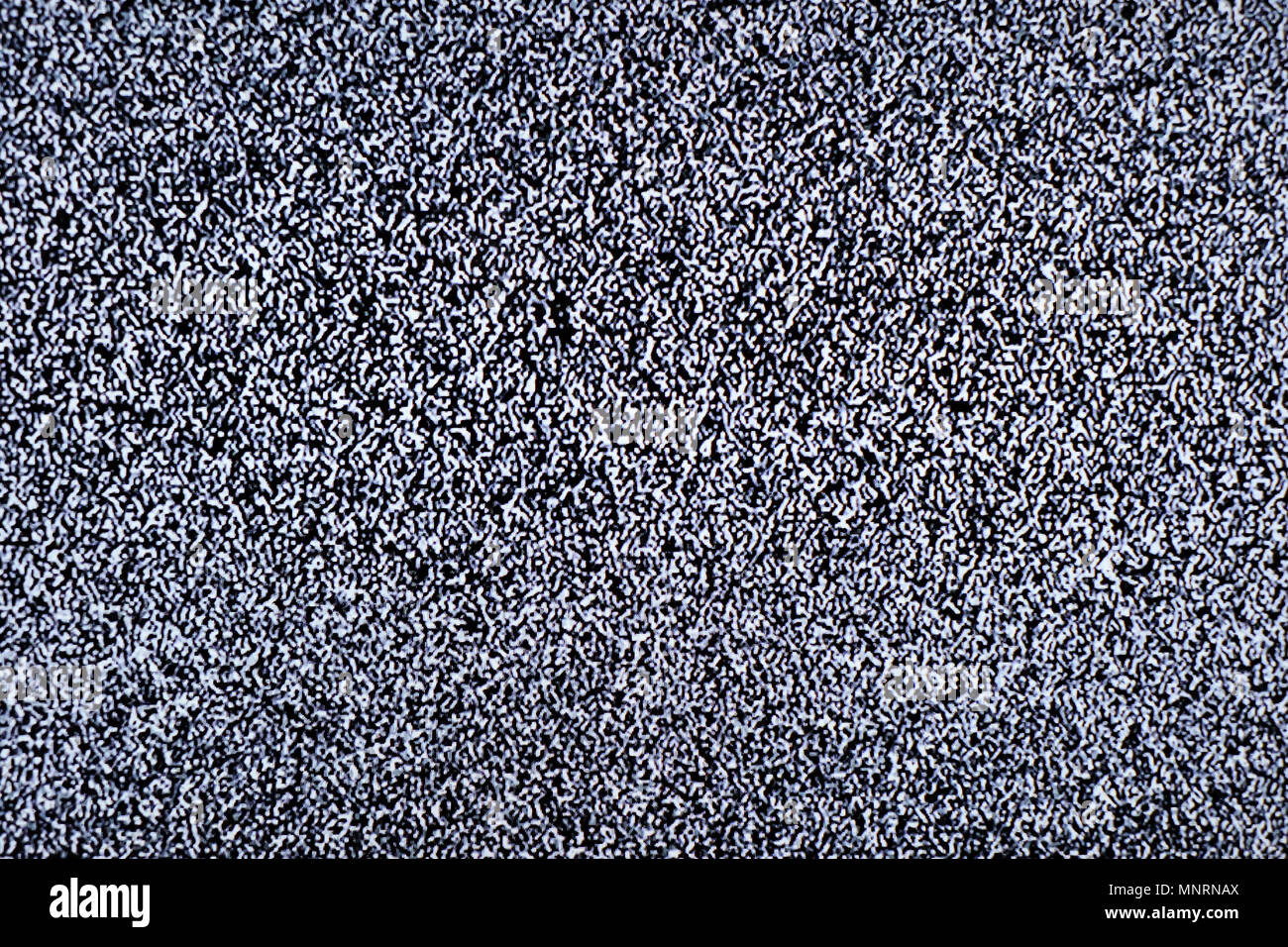 Tv-Bildschirm mit statisches Rauschen durch schlechten Empfang oder kein Signal verursacht. Zusammenfassung Hintergrund. Stockfoto
