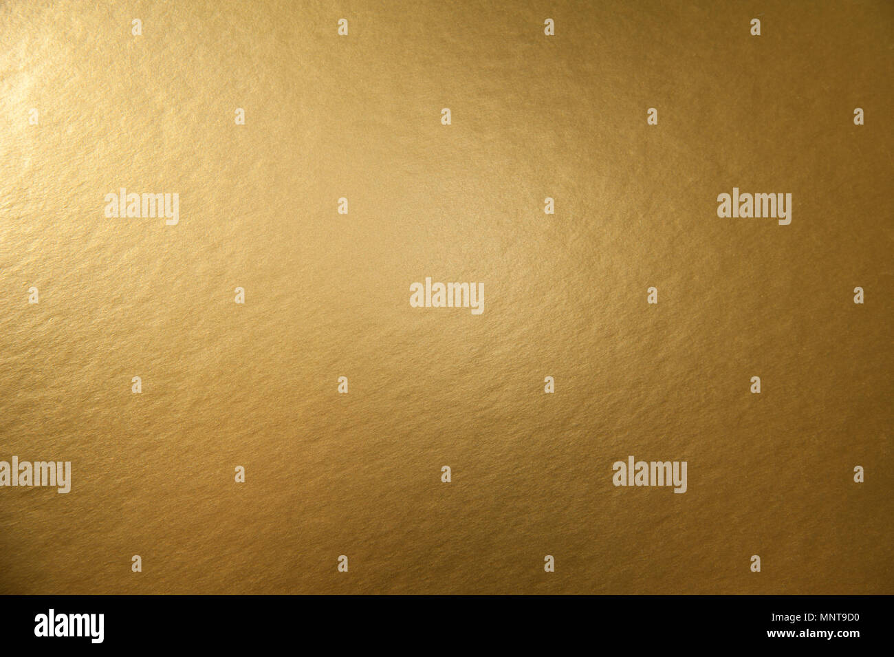 Textur des Goldenen metallische Folie Papier Hintergrund für Design Weihnachten oder Silvester oder Party Karten Stockfoto