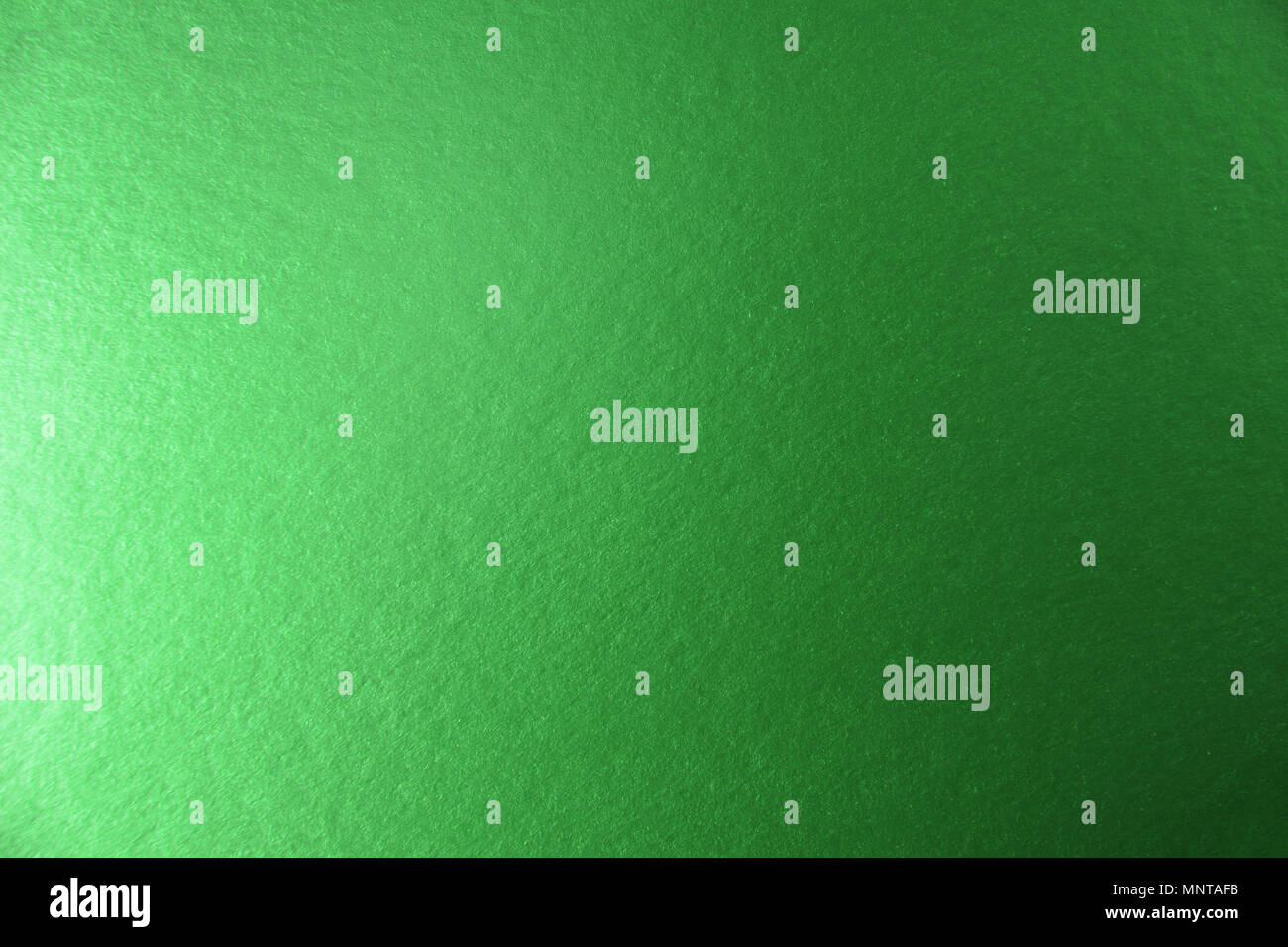 Textur von grün metallic Folie Papier Hintergrund für Design Weihnachten oder Silvester oder Party Karten Stockfoto