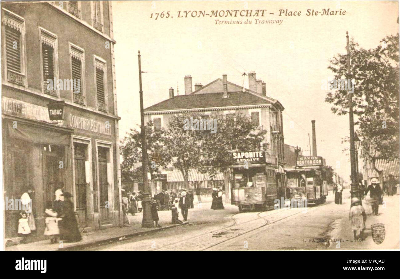 Lyon-Montchat. Ort Saint-marie. Terminus du Tramway. An einer Kreuzung zwei Straßenbahnen kreuzen sich wegen einer Spur Vervielfältigung. Jede Straßenbahn nimmt seine Leistung mit einer Stange. Diese Pole melden Sie zwei elektrische Kabel von Kabel zwischen Polen auf beiden Seiten der Fahrbahn gespannt. Das Dach ist Werbeträger: für eine "aponite Waschen" und den anderen "Buttercup Seife". Der Boden ist gepflastert mit Schiene. Auf der rechten Seite ist ein scheinbar kontinuierlichen bürgersteig, auf dem Hintergrund führt zu einem Handel, dass die gestreiften Markise abgesenkt wird. Auf der linken Seite, eine mehr als 2-stöckiges Gebäude, erhält im Erdgeschoss Stockfoto