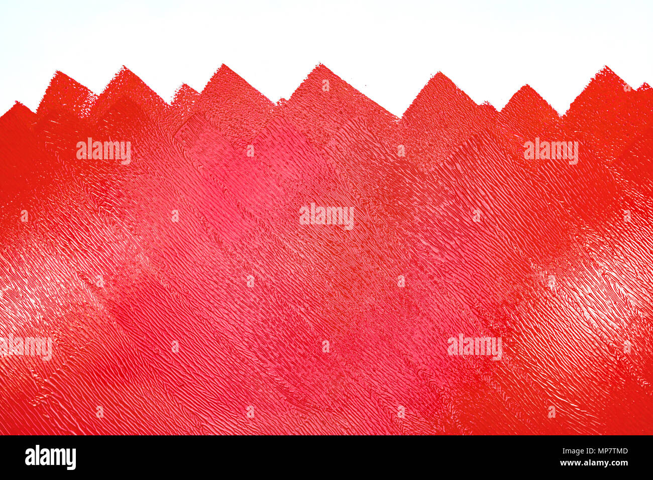 Bürstenrolle Malerei. unfertige bemalte Wand mit roter Farbe Farbe Stockfoto