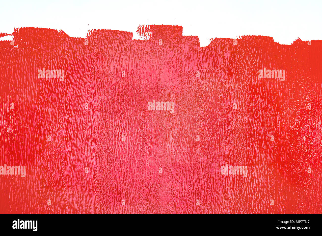 Teilweise bemalte Mauer in roten Farben. Renovierung home Konzept Stockfoto