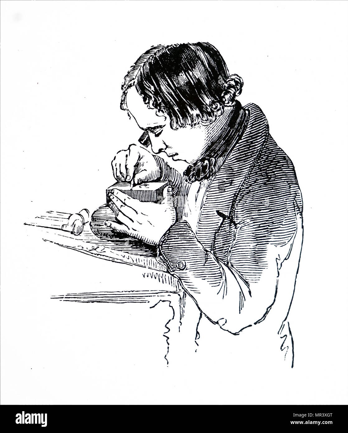 Holzstich, Graveur in einem Block mit Hilfe der ein Auge - Glas. Vom 19. Jahrhundert Stockfoto