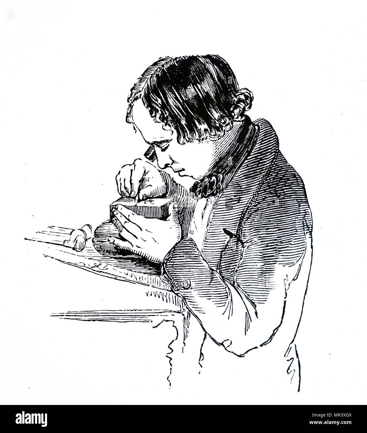 Holzstich, Graveur in einem Block mit Hilfe der ein Auge - Glas. Vom 19. Jahrhundert Stockfoto
