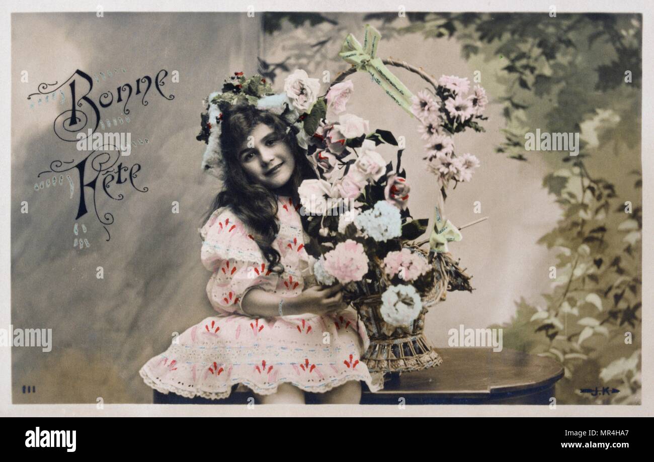 Französische neues Jahr Postkarte, ein junges Mädchen mit einem Korb mit Blumen 1900 Stockfoto