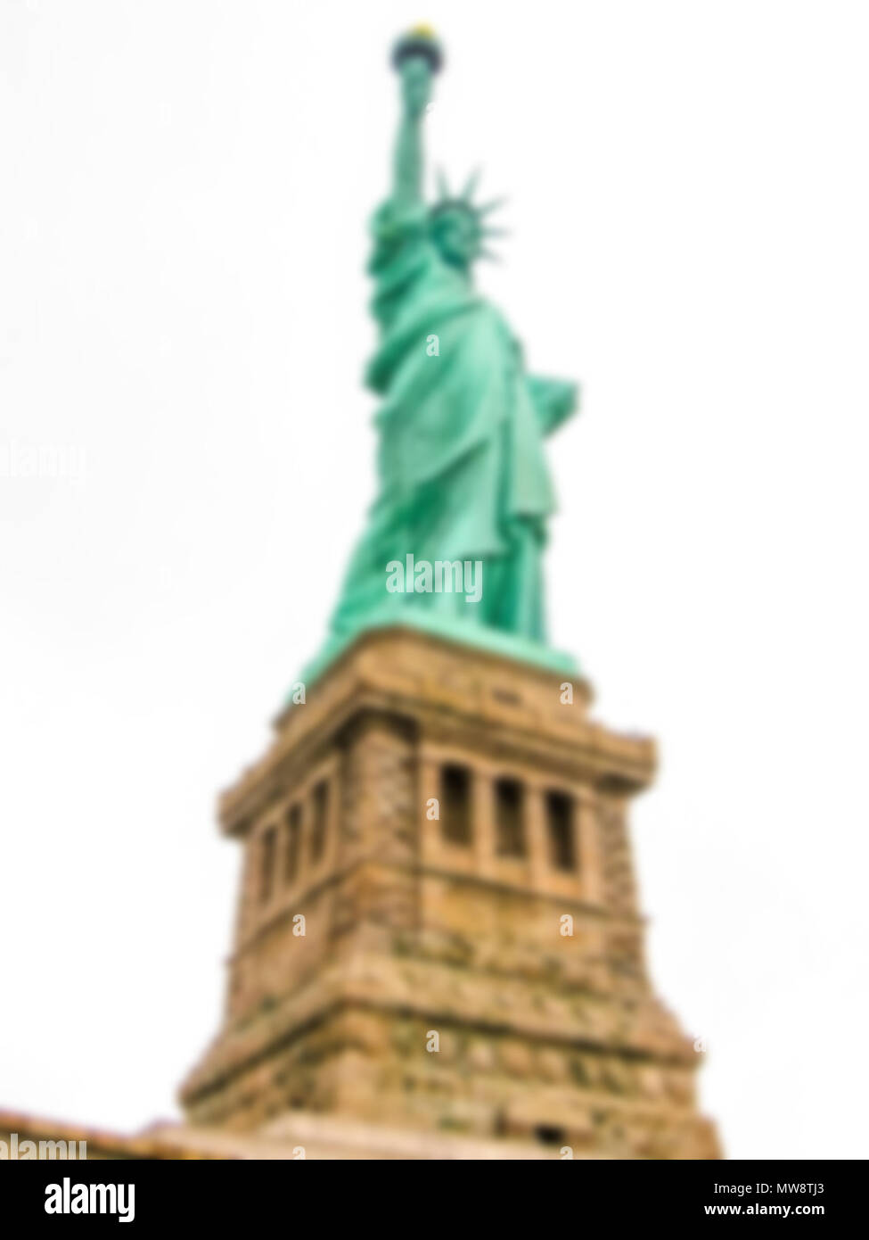Defokussiertem Hintergrund mit Freiheitsstatue, New York City, USA. Absichtlich verschwommene Postproduktion für bokeh Effect Stockfoto