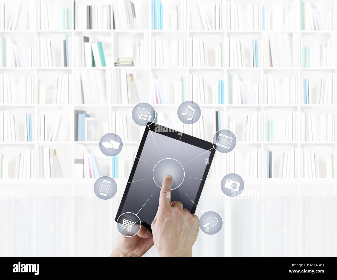 Hand berühren digitalen Tablet mit Symbolen auf Bibliothek Hintergrund isoliert Stockfoto