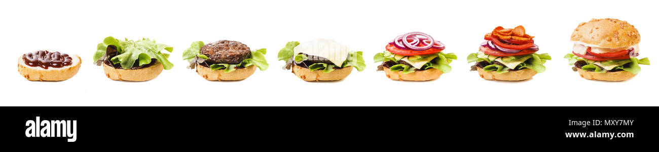 Herstellung von Hamburgern, Burgerzutaten isoliert auf weißem Hintergrund Stockfoto