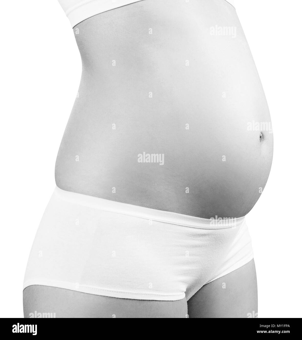 Schwangere Frau präsentiert Bauch. Mutterschaft Konzept. Stockfoto