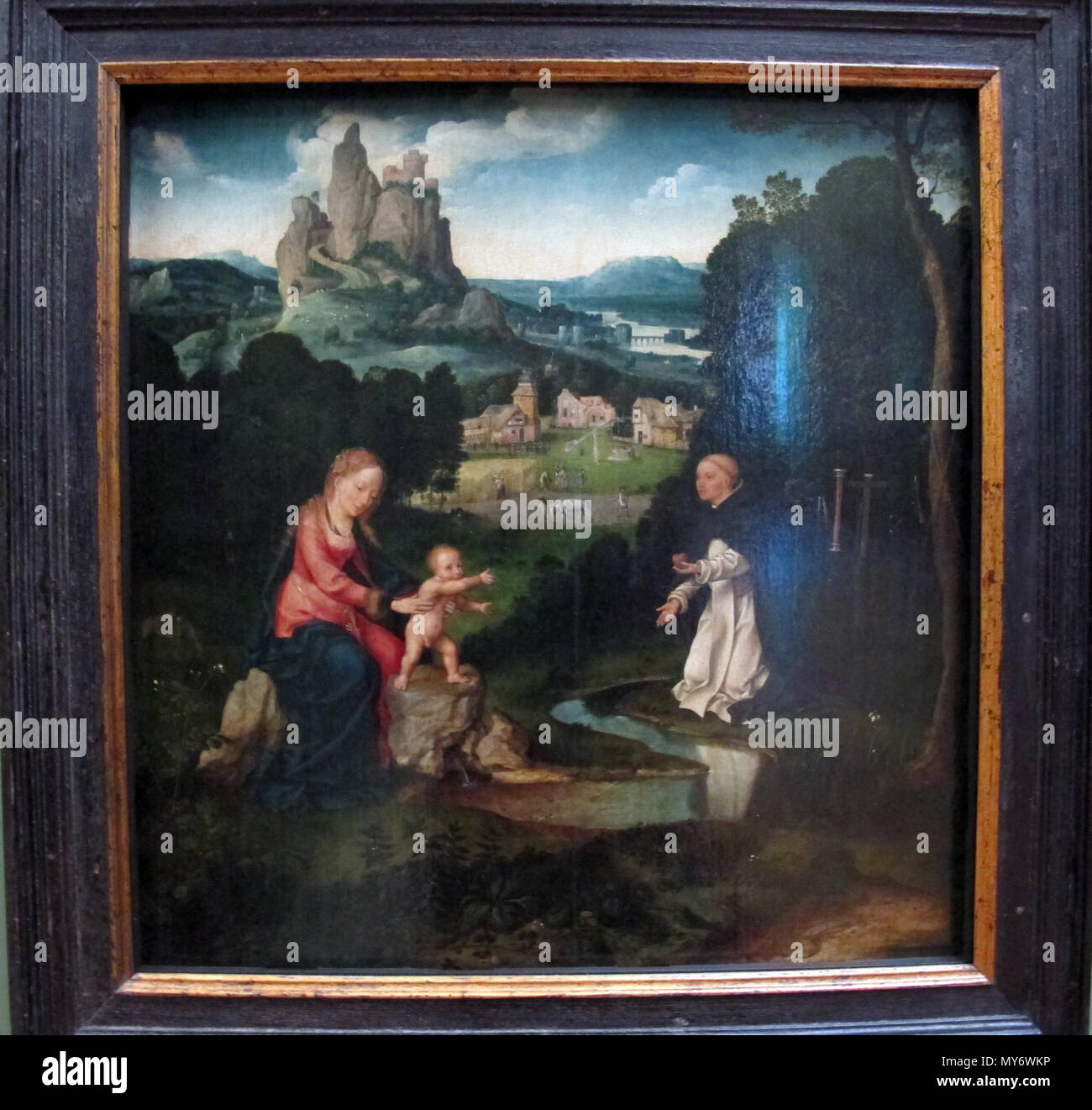 . Madonna mit Kind und ein Dominikaner mit Seinem Herzen. Italiano: Pittura fiamminga al Louvre, Parigi. 15 November 2013, 10:04:57. Sailko 281 Joos van Cleve, che domenicano offre Il suo Cuore alla Madonna col Bambino, 1500-1520 Ca. Stockfoto