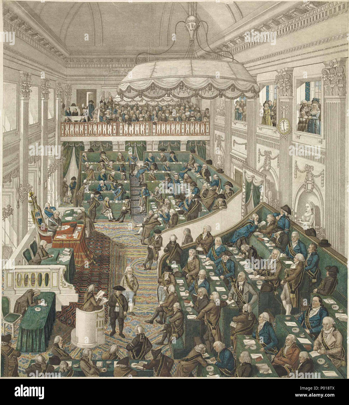 . Nederlands: Zitting van de Eerste Nationale Vergadering in Den Haag, van 1 maart 1796 tot 31 Augustus 1797. Gezicht in de voormalige vergaderzaal (Stadhouderlijke danszaal Van Het Paleis) met de Registrierte, allen met lint van de Orlando-vertreter. Links de Voorzitter Pieter Paulus, links vooraan een spreker op het spreekgestoelte. Op de achtergrond de volle publieke Tribune. Englisch: Erste Sitzung der Nationalversammlung in Den Haag, die Batavische Republik (die Niederlande), ab 1. März 1796 bis 31. August 1797. Ansicht der Baugruppe Hall (ehemaligen Ballsaal des Stadthalter Palast) mit seinen Mitgliedern, Stockfoto