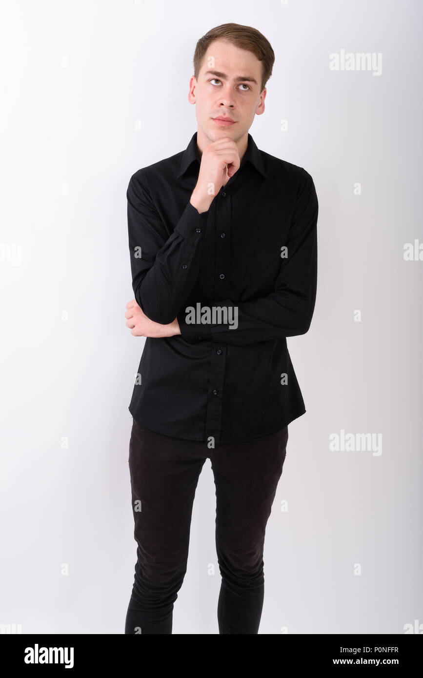 Junge gut aussehender Geschäftsmann vor weißem Hintergrund Stockfoto