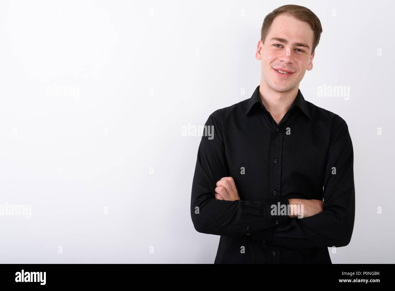 Junge gut aussehender Geschäftsmann vor weißem Hintergrund Stockfoto